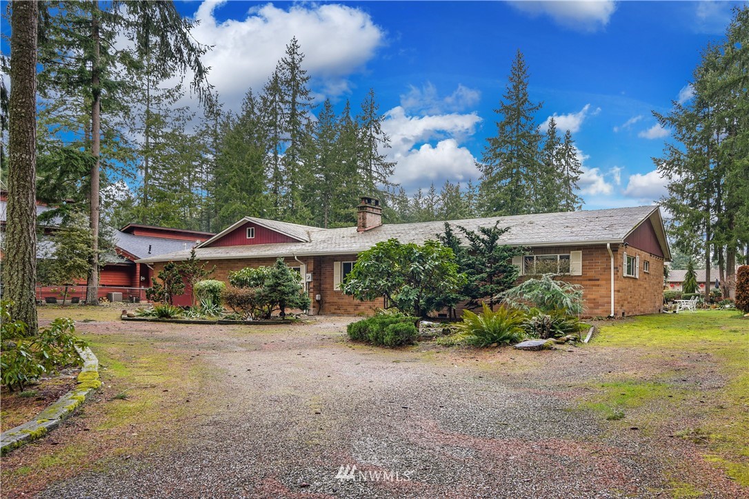 17618 Southeast 293rd Place Kent, WA 98042 - Photo 1 of 35 a view of a house with a yard and large tree