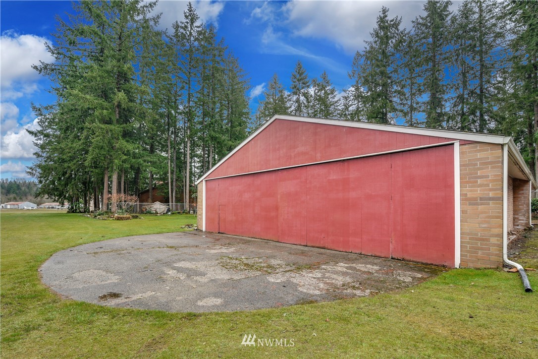 17618 Southeast 293rd Place Kent, WA 98042 - Photo 24 of 35 a backyard of a house with lots of green space