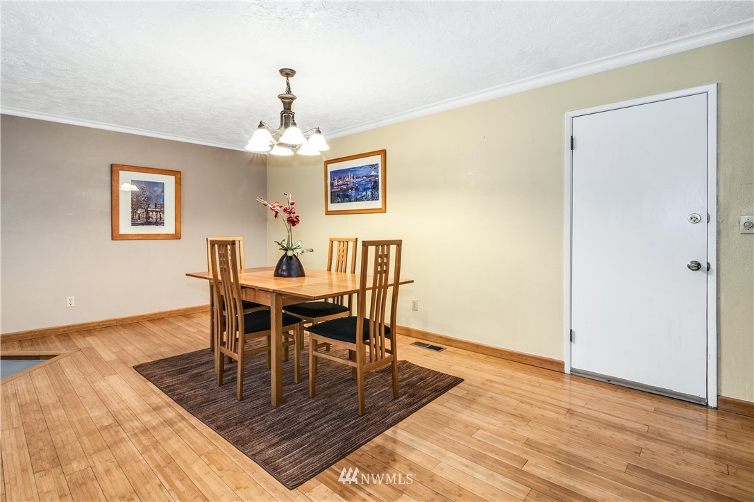 17618 Southeast 293rd Place Kent, WA 98042 - Photo 8 of 35 a view of a dining room with furniture and wooden floor