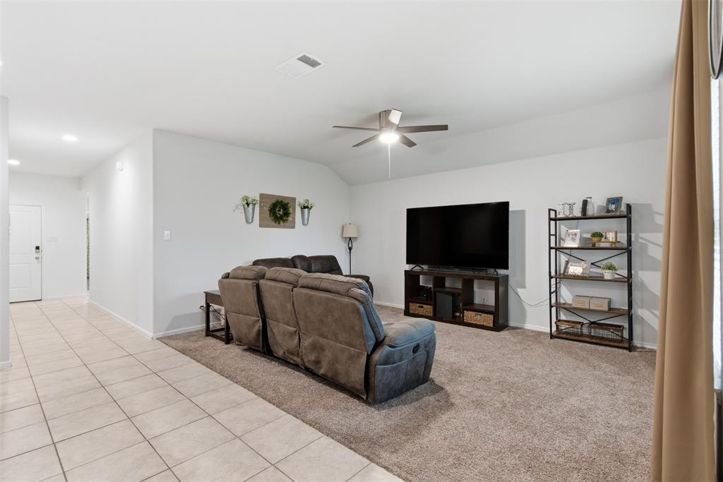 3400 Quiet Valley Road Fort Worth, TX 76123 - Photo 10 of 31 a living room with furniture and a flat screen tv