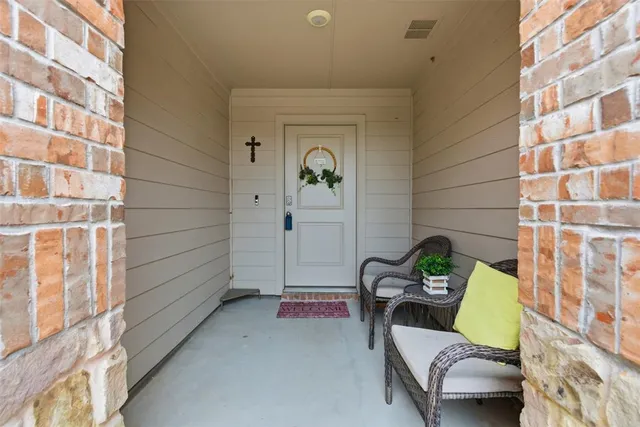 a picture of a room with a white wall and a refrigerator