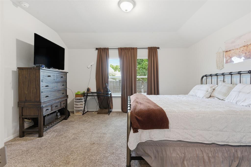 3400 Quiet Valley Road Fort Worth, TX 76123 - Photo 6 of 31 a bedroom with a bed and flat screen tv