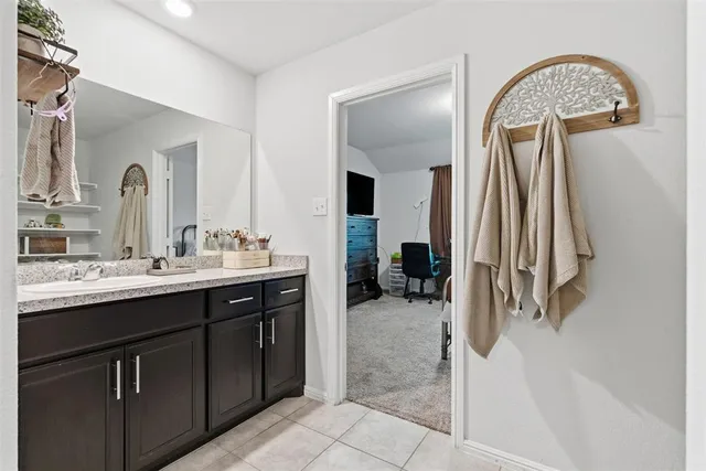 a bedroom with a bed and flat screen tv