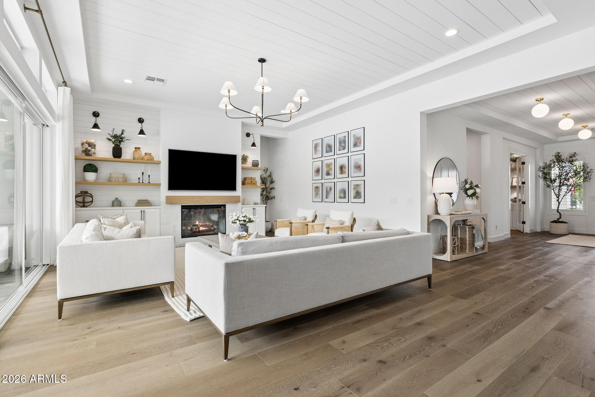 2633 East Geronimo Street Gilbert, AZ 85295 - Photo 11 of 78 a living room with furniture and a flat screen tv