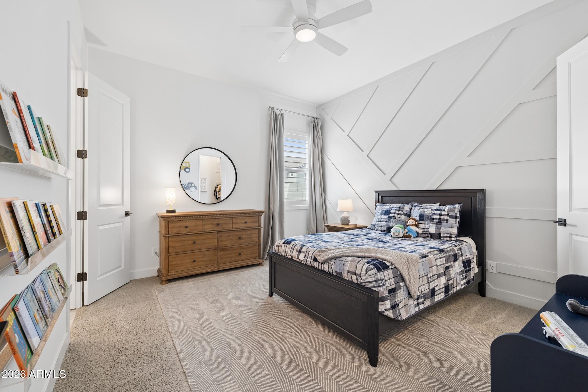 2633 East Geronimo Street Gilbert, AZ 85295 - Photo 42 of 78 a bedroom with a bed a mirror and a table