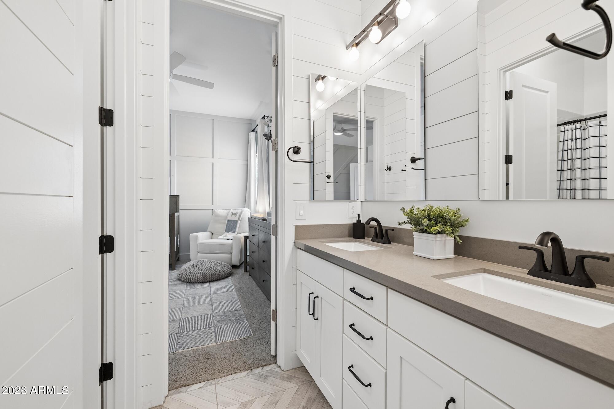 2633 East Geronimo Street Gilbert, AZ 85295 - Photo 44 of 78 a bathroom with a sink a potted plant and a shower