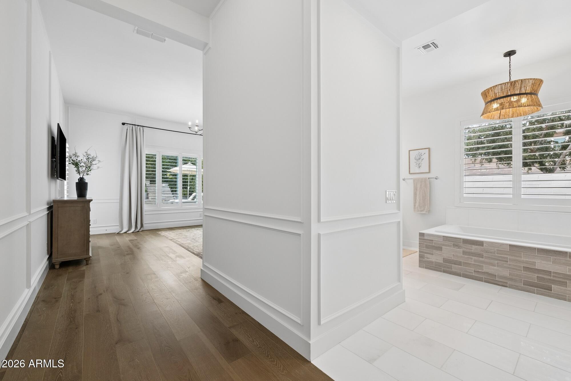 2633 East Geronimo Street Gilbert, AZ 85295 - Photo 48 of 78 a view of a hallway with wooden floor and a living room