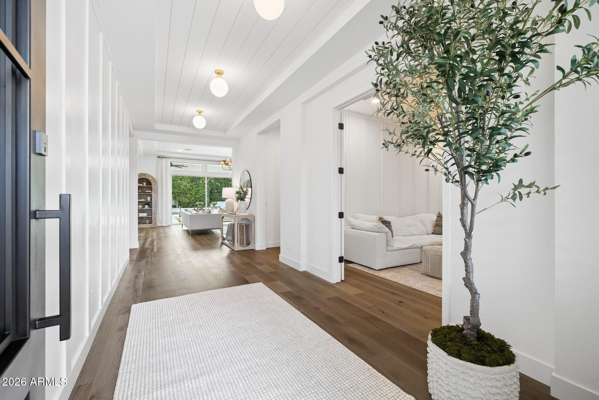 2633 East Geronimo Street Gilbert, AZ 85295 - Photo 6 of 78 a living room with furniture and a floor to ceiling window