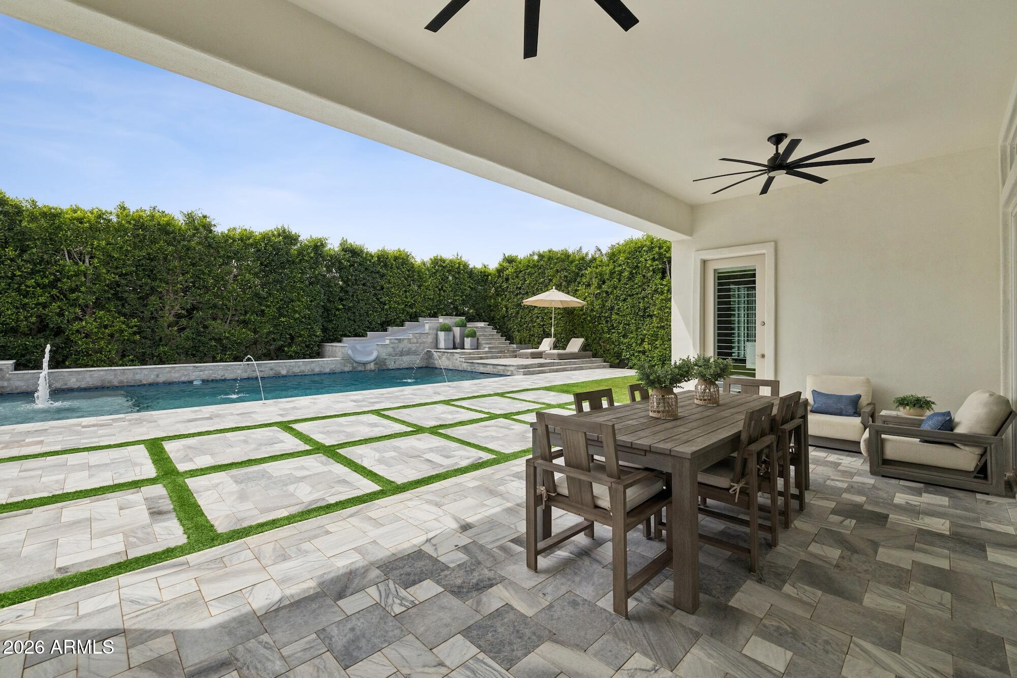 2633 East Geronimo Street Gilbert, AZ 85295 - Photo 62 of 78 a view of a patio with a table chairs and a swimming pool