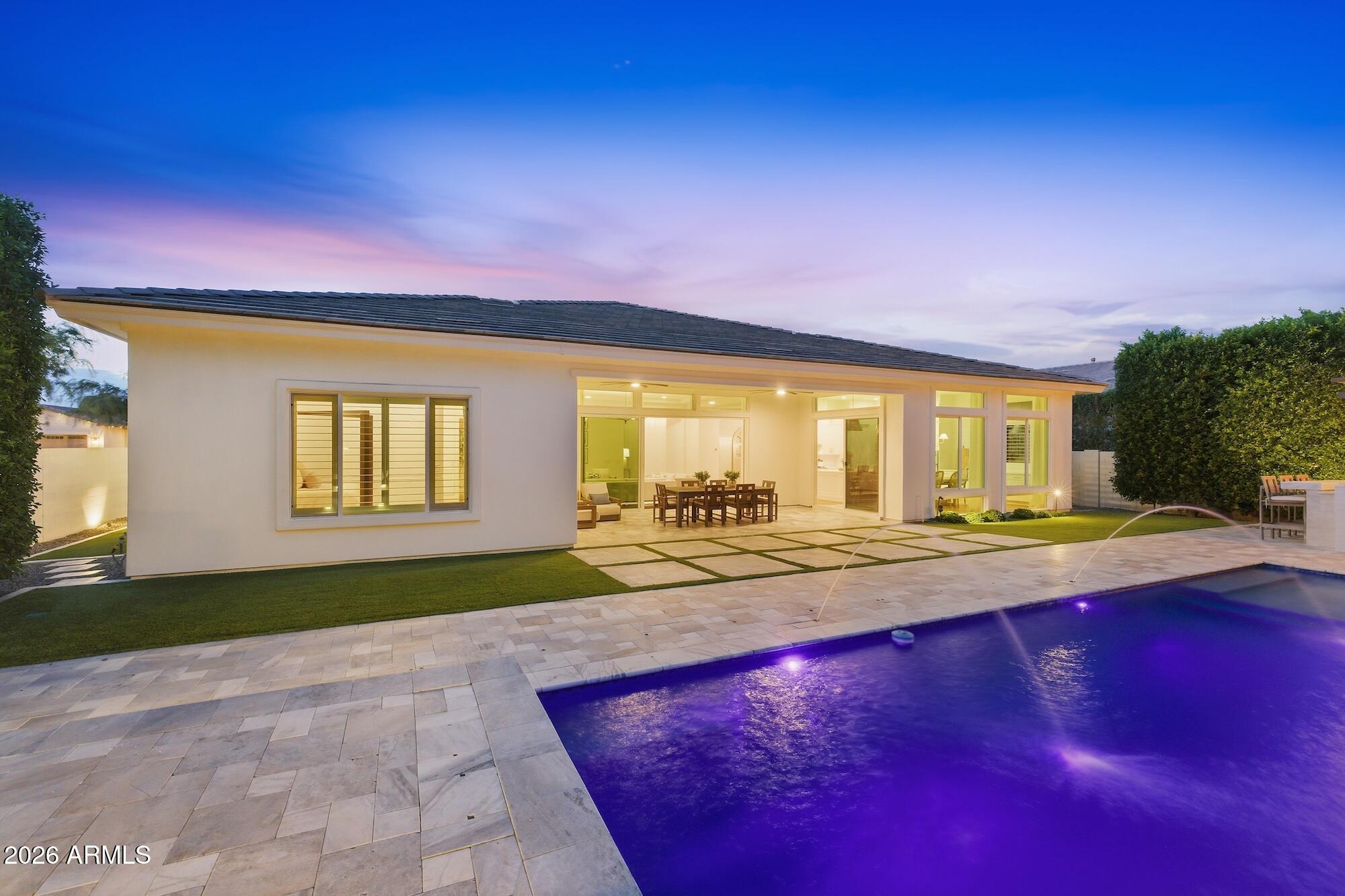 2633 East Geronimo Street Gilbert, AZ 85295 - Photo 70 of 78 a view of a swimming pool with an outdoor space and seating area