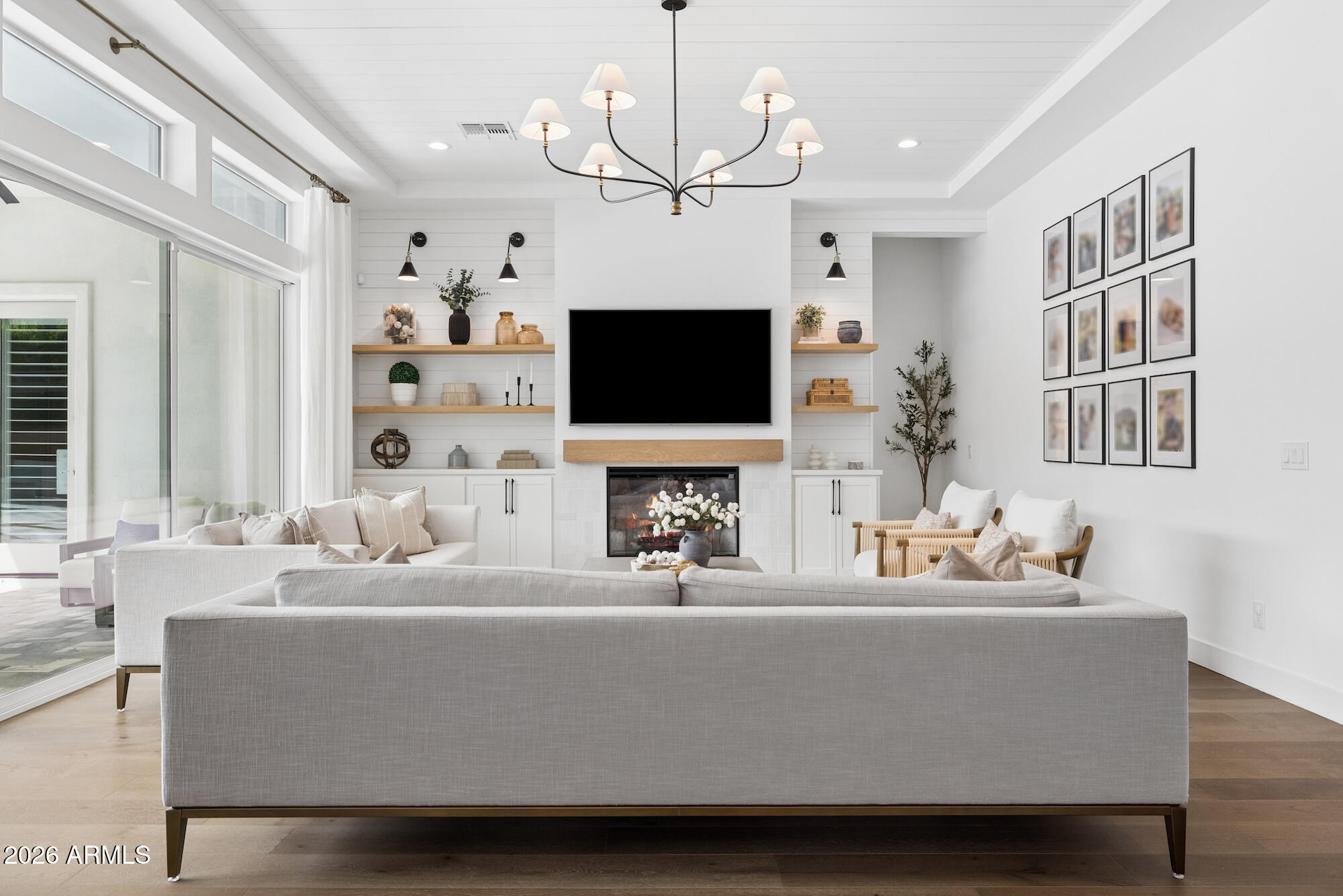 2633 East Geronimo Street Gilbert, AZ 85295 - Photo 10 of 78 a living room with fireplace furniture and a flat screen tv