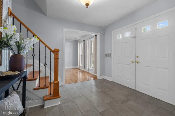 a view of an entryway with wooden floor