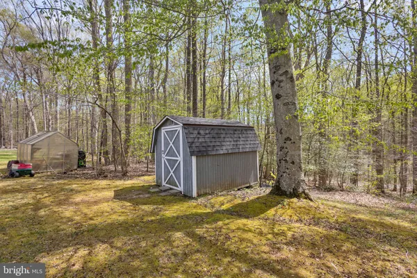 an aerial view of a house with outdoor space