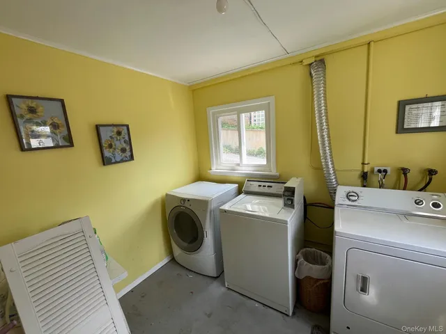 a view of a park with trees in the background