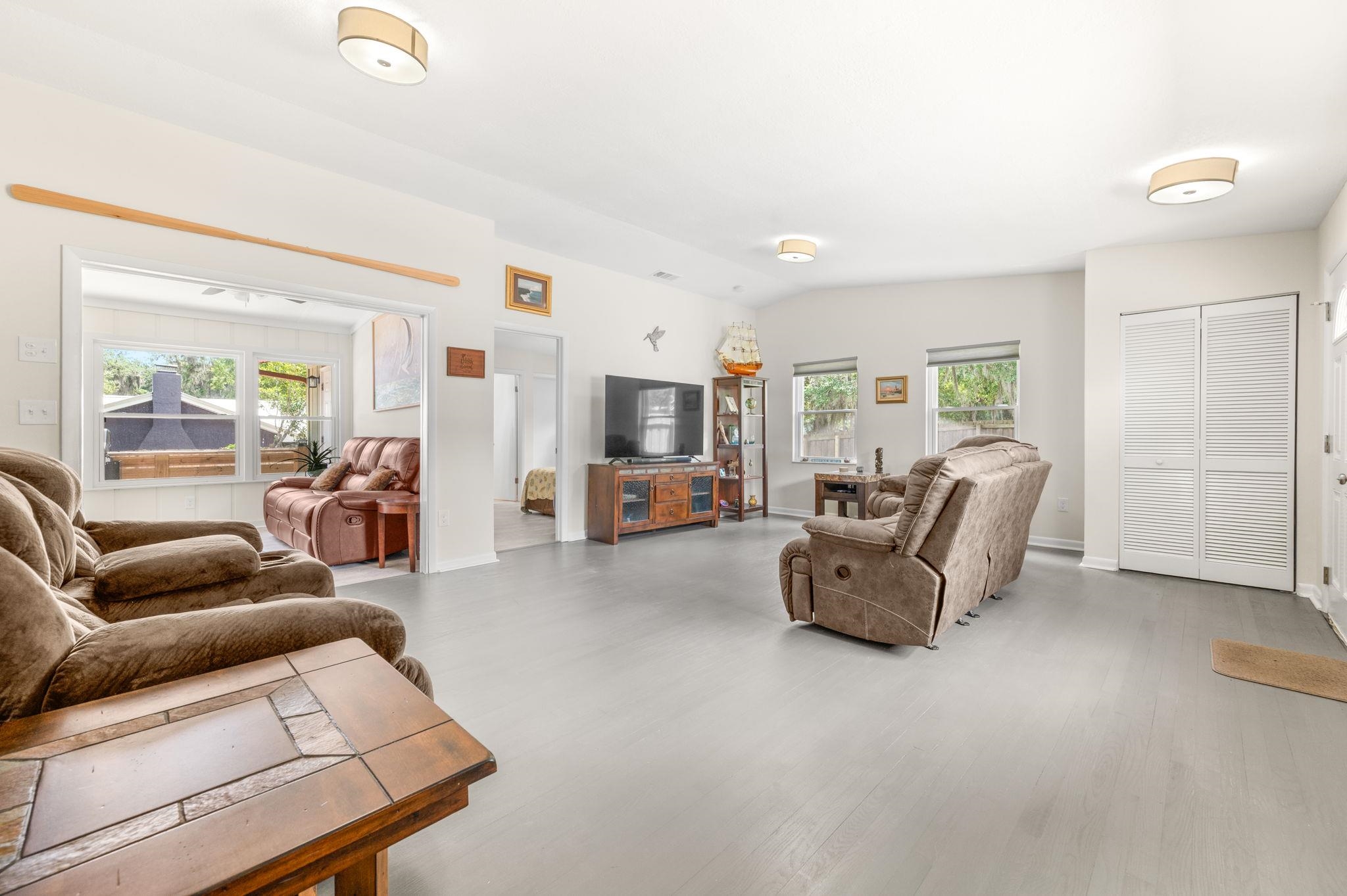 507 Gentian Road St. Augustine, FL 32086 - Photo 7 of 82 a living room with furniture and a flat screen tv