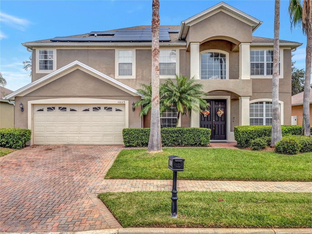 10023 Ians Ridge Road Orlando, FL 32832 - Photo 45 of 60 a front view of a house with a yard