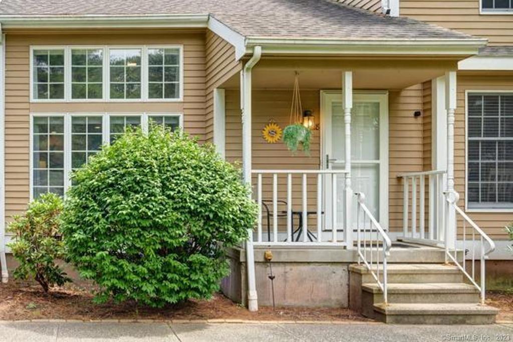 697 South End Road, Unit 38 Southington, CT 06479 - Photo 1 of 1 front view of of house with potted plants