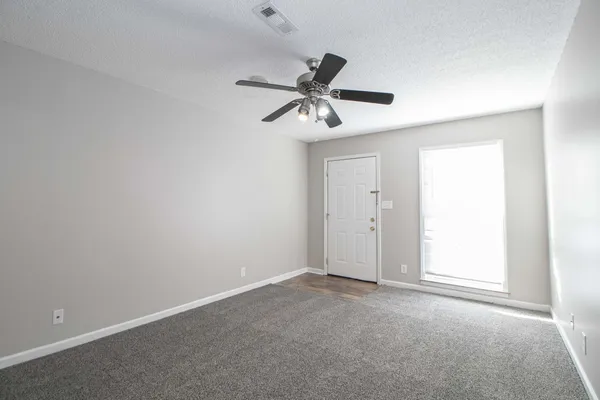 a view of a ceiling fan in a room