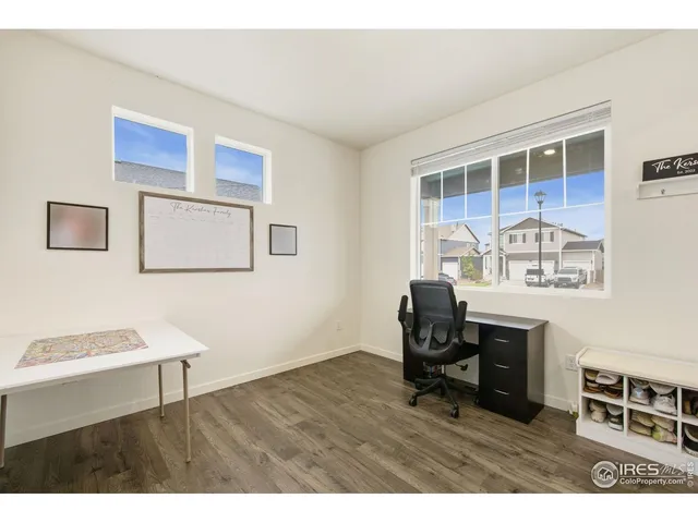 a living room with furniture and a piano