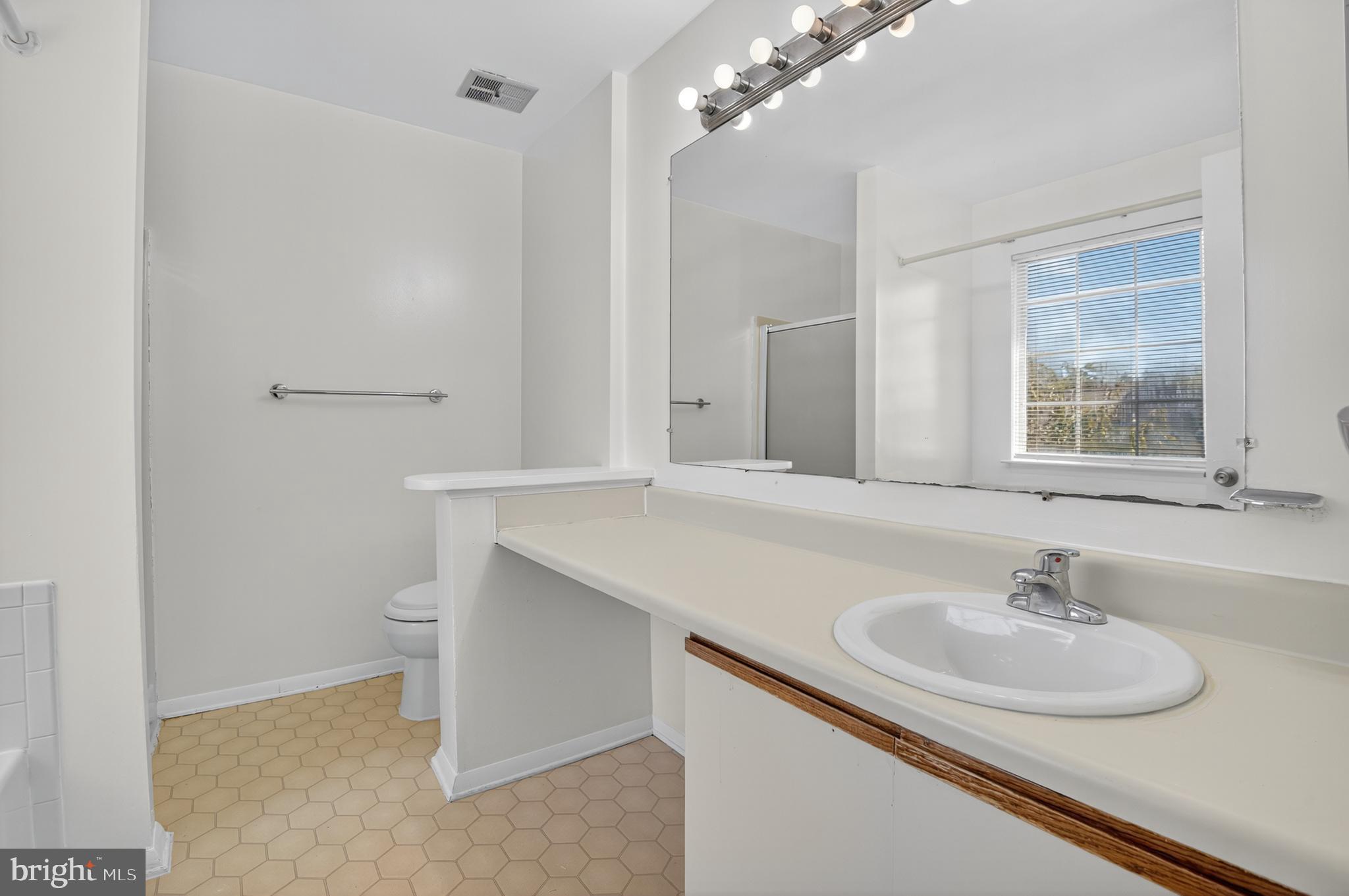 18314 Hallmark Court Gaithersburg, MD 20879 - Photo 21 of 26 a bathroom with a sink and a mirror