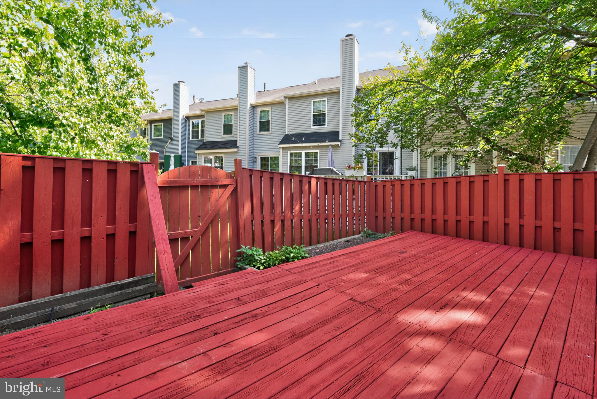 18314 Hallmark Court Gaithersburg, MD 20879 - Photo 23 of 26 a view of a backyard with wooden fence