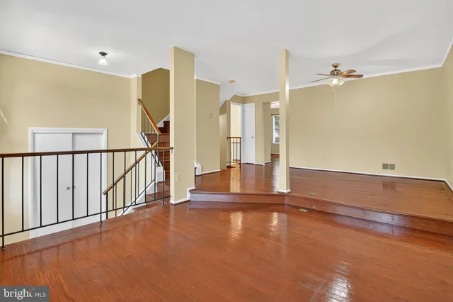 a view of a room with floor to ceiling window and stairs