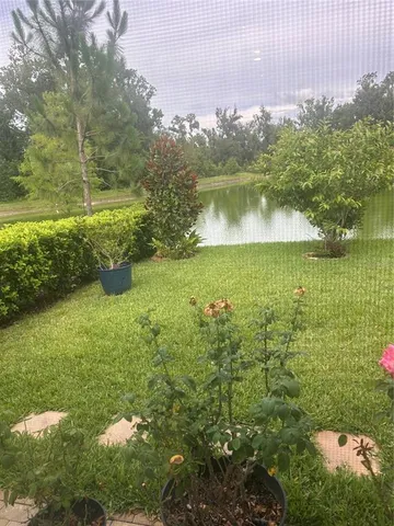 a view of a lake with a yard