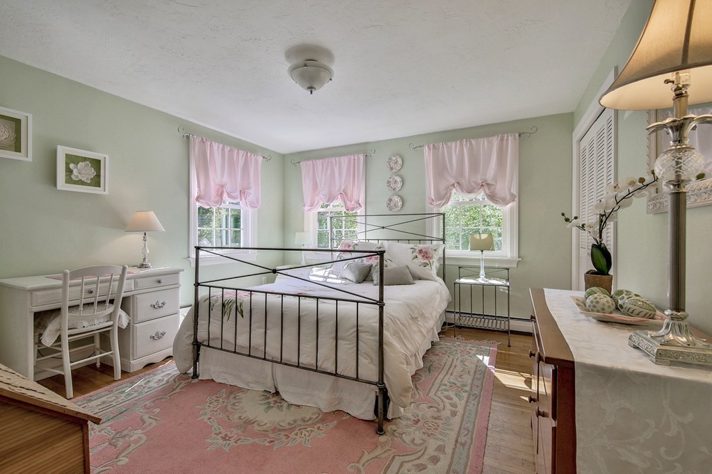 102 Fitzpatrick Road Grafton, MA 01519 - Photo 14 of 25 a bed room with a bed window and a flat tv screen