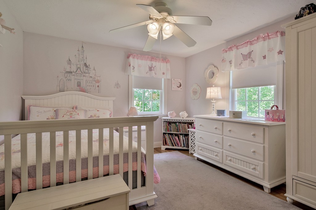 102 Fitzpatrick Road Grafton, MA 01519 - Photo 16 of 25 a bedroom with a bed and a chandelier fan
