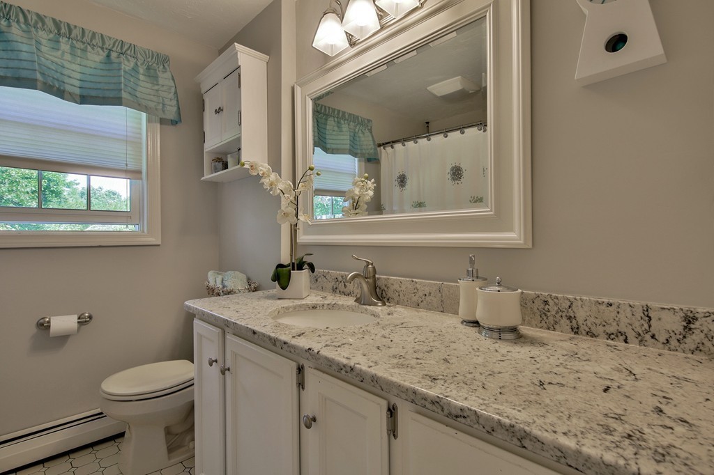102 Fitzpatrick Road Grafton, MA 01519 - Photo 18 of 25 a bathroom with a granite countertop sink and a mirror
