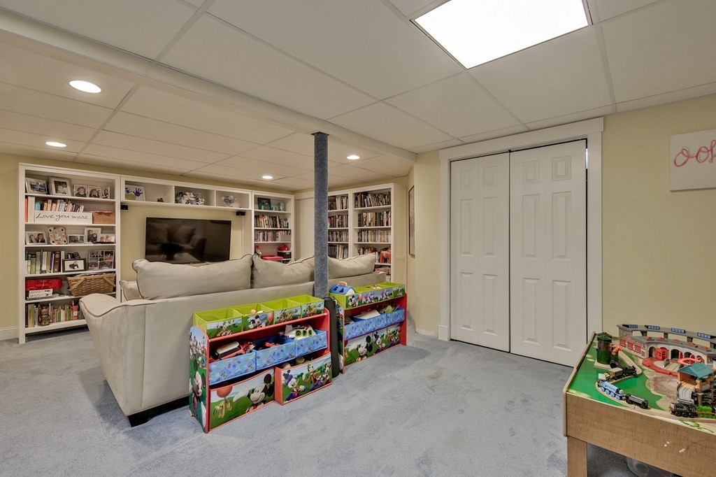102 Fitzpatrick Road Grafton, MA 01519 - Photo 20 of 25 a living room with furniture and a flat screen tv
