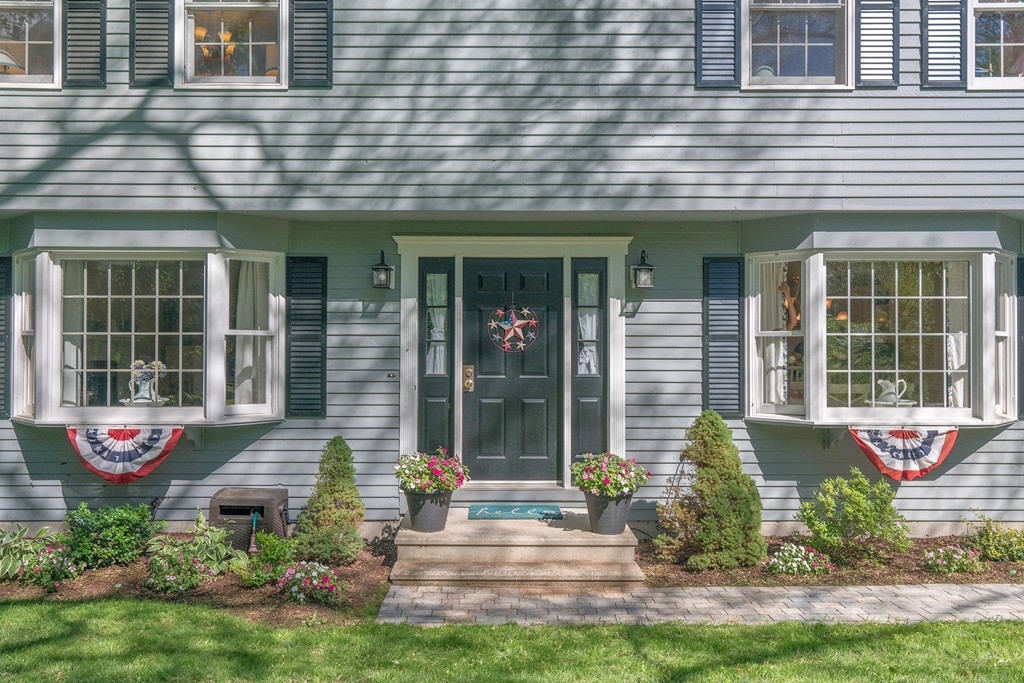 102 Fitzpatrick Road Grafton, MA 01519 - Photo 2 of 25 a front view of a brick house with a yard