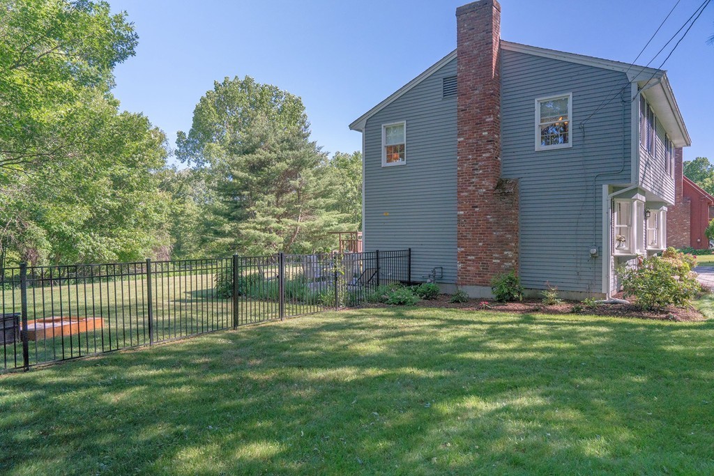 102 Fitzpatrick Road Grafton, MA 01519 - Photo 22 of 25 a view of a backyard with a small cabin