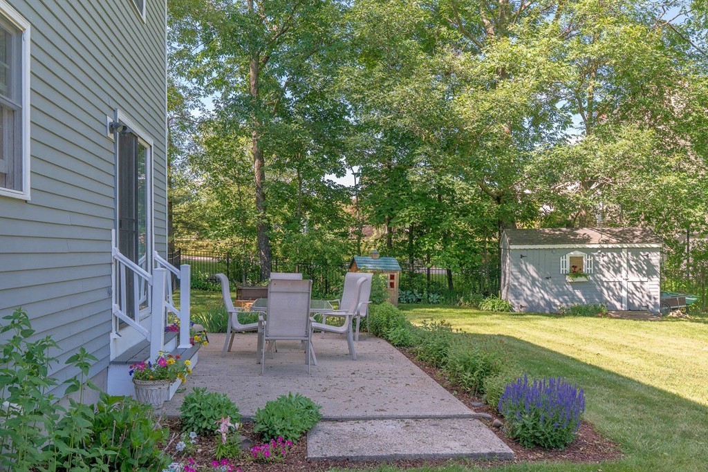 102 Fitzpatrick Road Grafton, MA 01519 - Photo 24 of 25 a view of a patio with table and chairs and potted plants