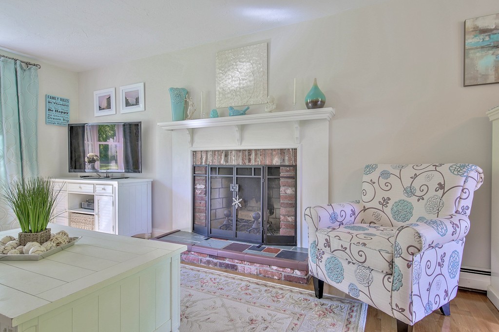 102 Fitzpatrick Road Grafton, MA 01519 - Photo 6 of 25 a living room with furniture and a fireplace