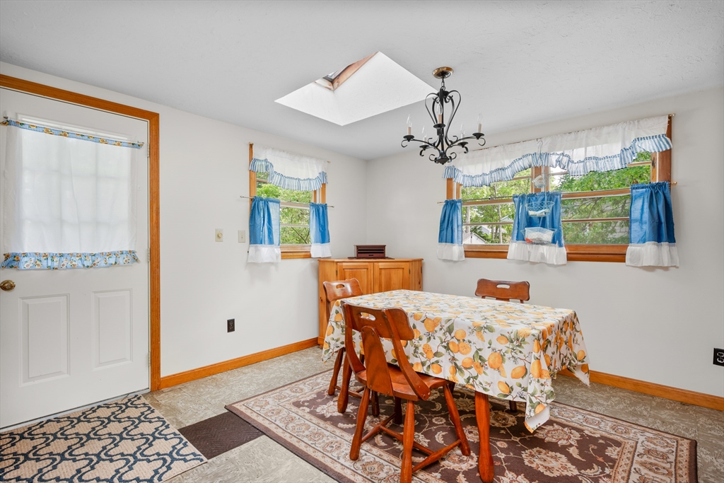 64 Uncle Percy's Road Mashpee, MA 02649 - Photo 12 of 33 a bedroom with a bed and wooden floor