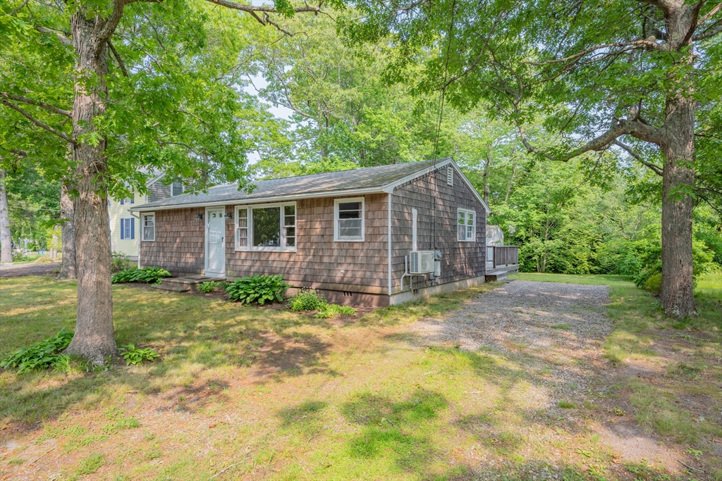 64 Uncle Percy's Road Mashpee, MA 02649 - Photo 2 of 33 a view of a house with yard and a tree