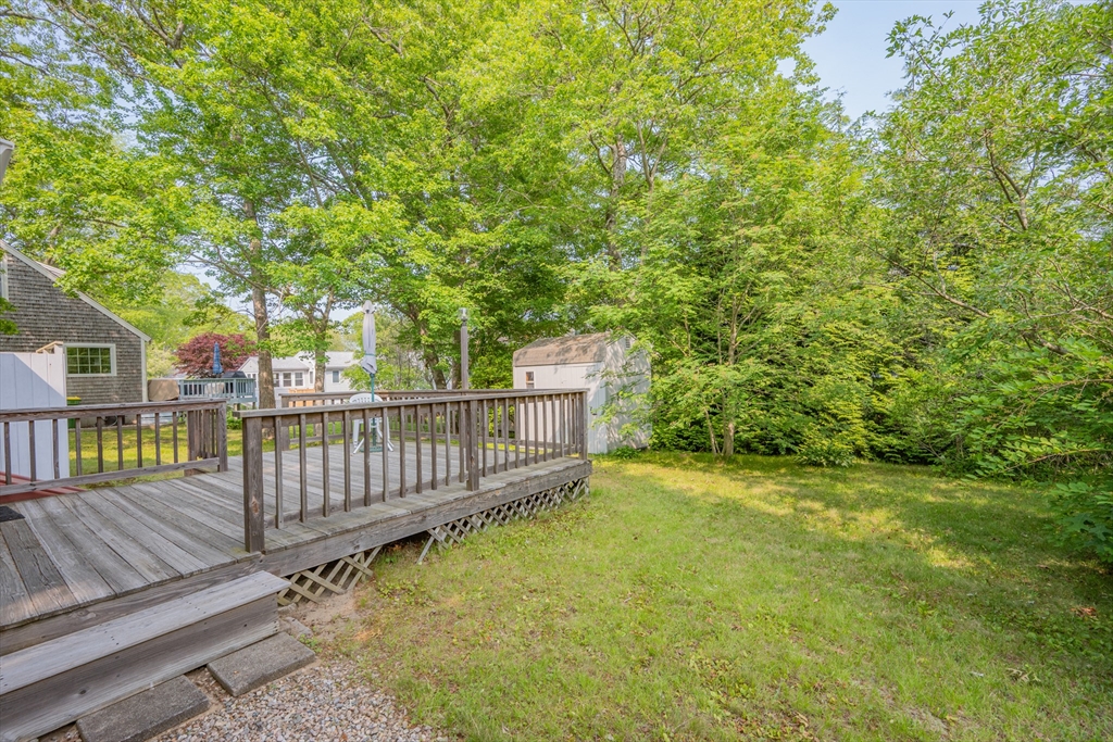 64 Uncle Percy's Road Mashpee, MA 02649 - Photo 22 of 33 a view of a garden with wooden fence