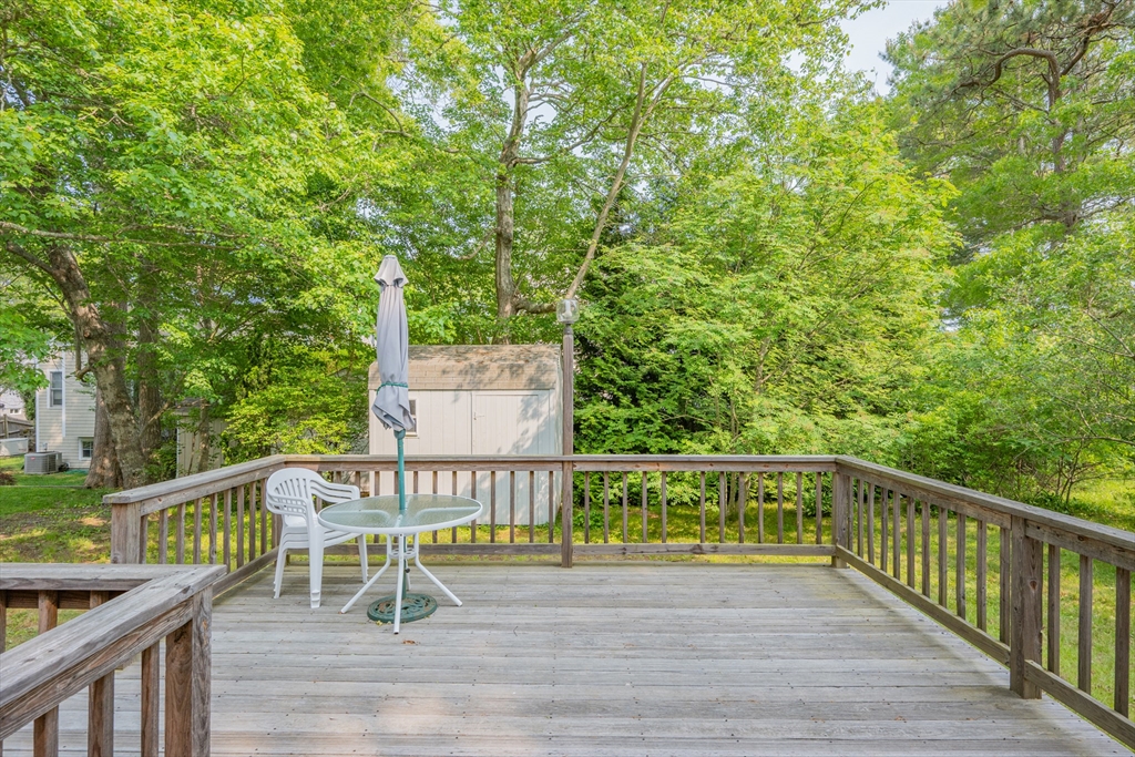 64 Uncle Percy's Road Mashpee, MA 02649 - Photo 24 of 33 a view of a chairs and table on the wooden floor
