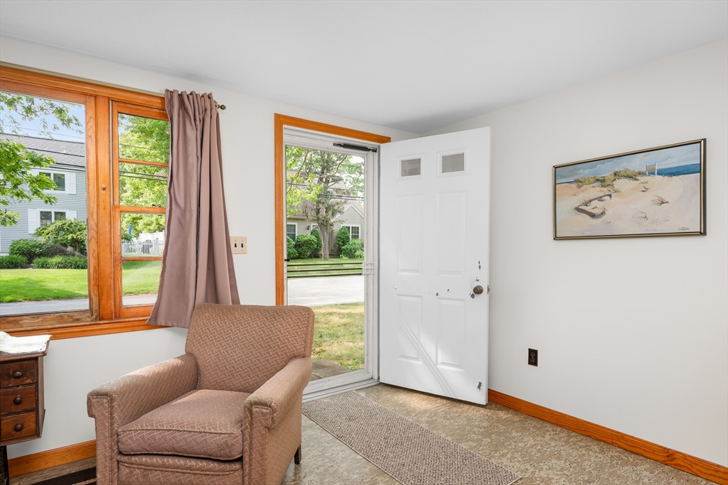 64 Uncle Percy's Road Mashpee, MA 02649 - Photo 4 of 33 a living room with furniture and a large window