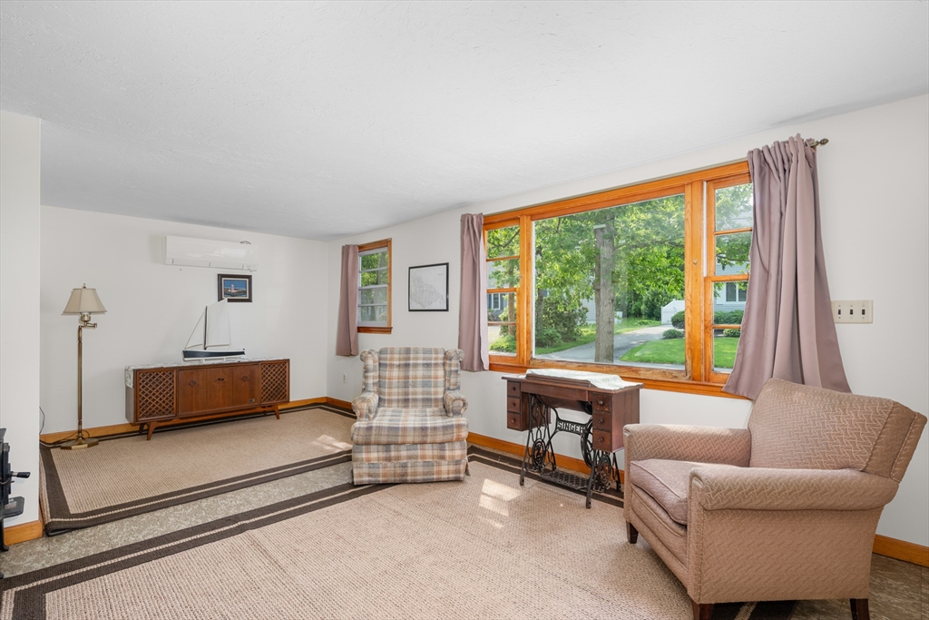 64 Uncle Percy's Road Mashpee, MA 02649 - Photo 5 of 33 a bedroom with furniture and a large window