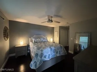 a bedroom with bed and a night stand