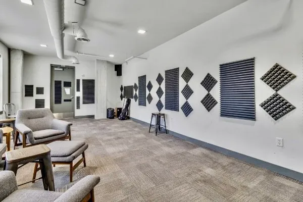 a living room with furniture and white walls