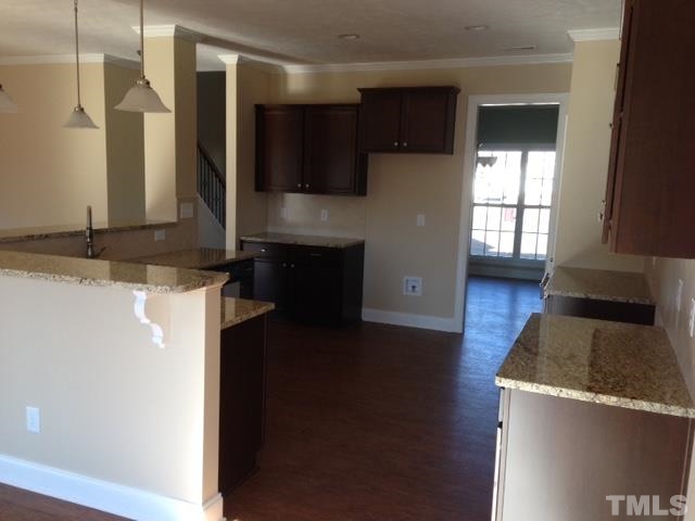 154 Culpepper Road Cameron, NC 28326 - Photo 4 of 25 a kitchen with stainless steel appliances granite countertop a sink and a stove top oven