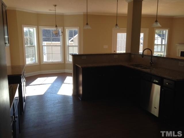 154 Culpepper Road Cameron, NC 28326 - Photo 5 of 25 a kitchen with stainless steel appliances a sink dishwasher a stove and a large window