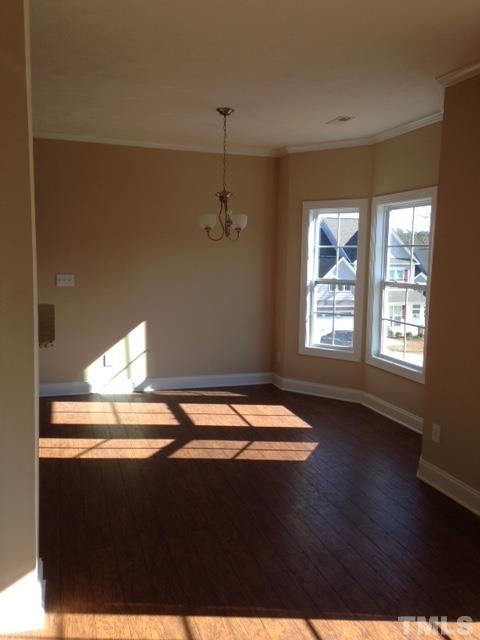 154 Culpepper Road Cameron, NC 28326 - Photo 7 of 25 a view of an empty room with window and wooden floor