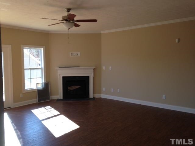 154 Culpepper Road Cameron, NC 28326 - Photo 8 of 25 an empty room with windows and fireplace