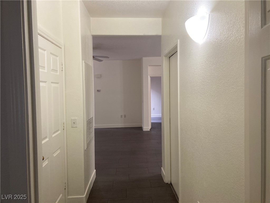 2001 Quartz Cliff Street, Unit 103 Las Vegas, NV 89117 - Photo 13 of 35 Hall with a textured wall and a heating unit
