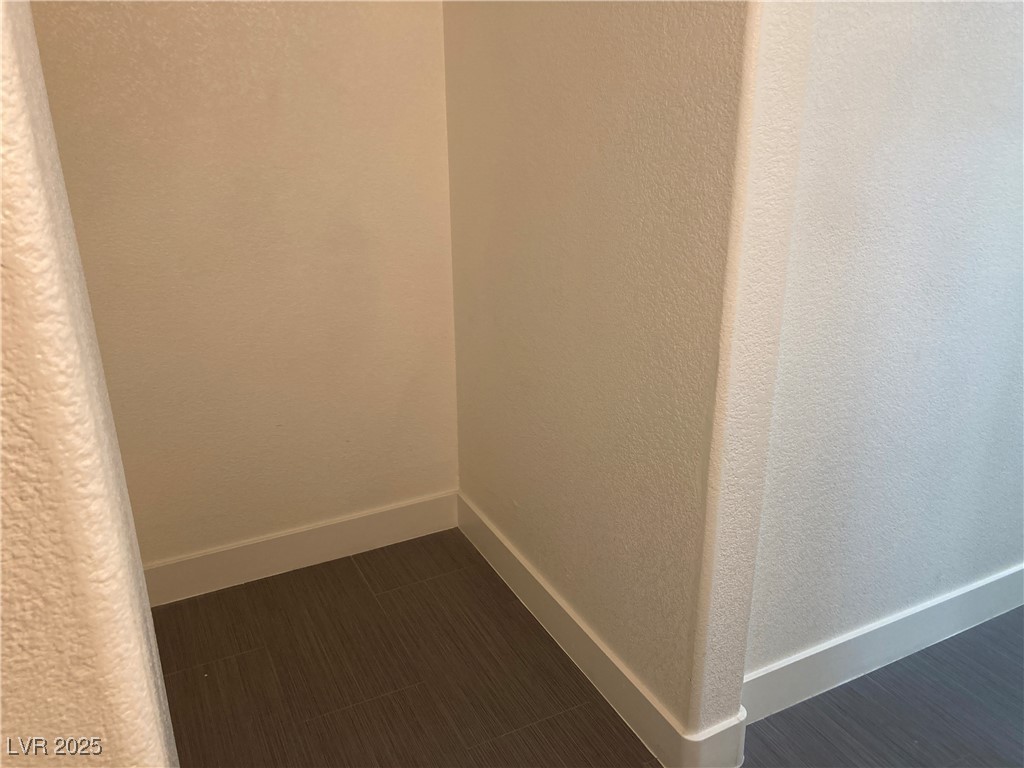 2001 Quartz Cliff Street, Unit 103 Las Vegas, NV 89117 - Photo 17 of 35 Spare room with baseboards and a textured wall