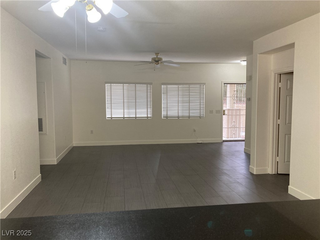 2001 Quartz Cliff Street, Unit 103 Las Vegas, NV 89117 - Photo 9 of 35 Unfurnished room with dark wood finished floors and a ceiling fan
